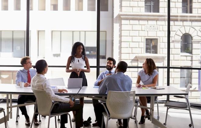 Businesspeople sitting around table