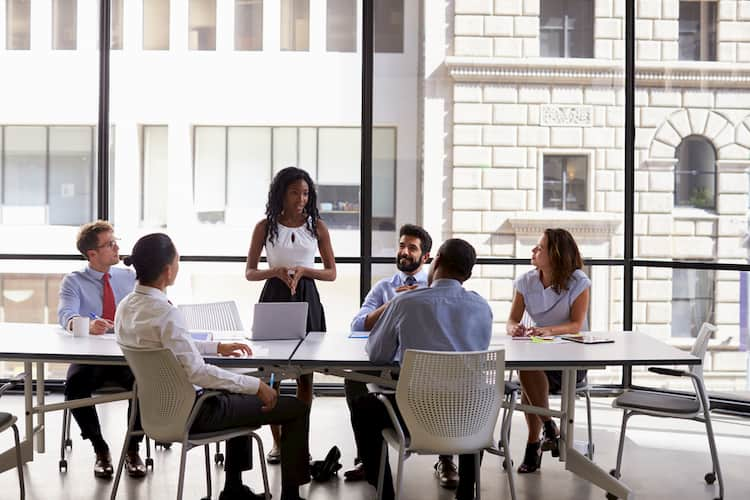 Businesspeople sitting around table