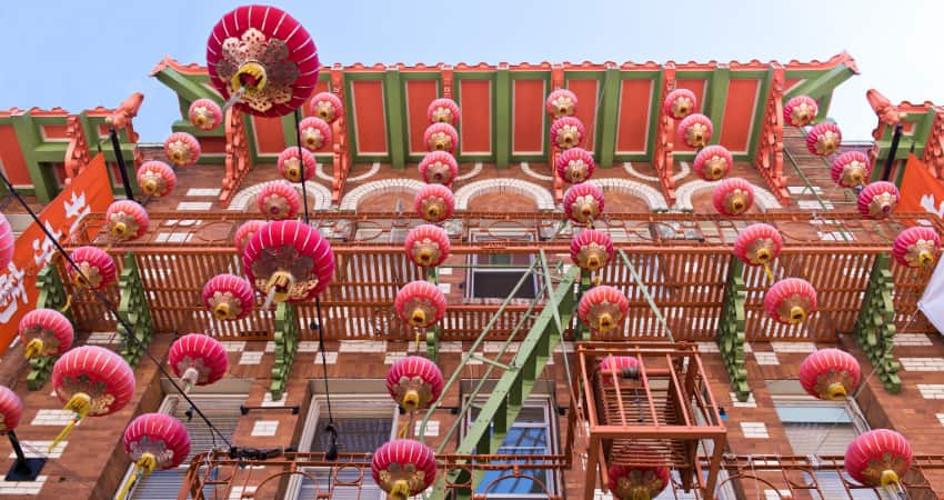 Red lanterns hang from an old building in Chinatown, San Francisco