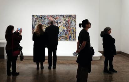 People viewing work in a museum gallery