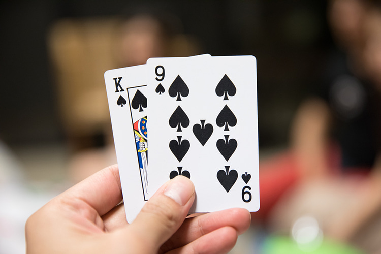 two cards held up in a hand