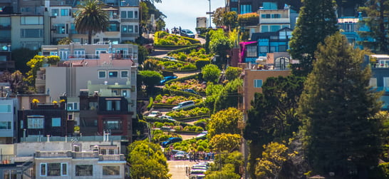 cars driving down lombard street in san francisco 